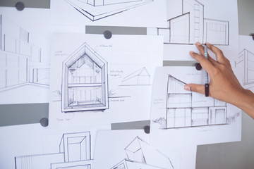 Architect Designer Engineer sketching drawing draft working Perspective Sketch  design house construction Project