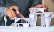 © Chaosamran_Studio - architect design working drawing sketch plans blueprints and making architectural construction model in architect studio