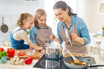 Wall Mural - Happy family in the kitchen.