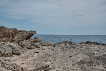 Wall Mural - cliffs by the sea and skyline in the middle of the picture