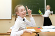 © ALEXEY - Girl schoolgirl rejoices that he knows the correct answer to the question. Invented a brilliant idea Schoolgirl had the idea of the right answer.