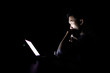© Olly - Lonely developer thinking solution with laptop at night in the dark room