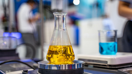 Canvas Print - Testing Blue Liquid Solution In Glass Flask In Science Laboratory