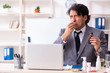 © Elnur - Man with flu working in the office