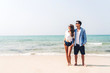 © Art_Photo - Romantic lovers young couple relaxing together on the tropical beach.Man hugging with woman and enjoy life.Summer vacations