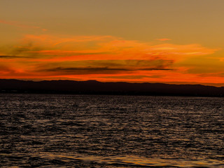 Sunset over the harbour, from the Birkenhead Whard, Waitemata Harbour, Auckland, New Zealand