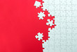 © Kenishirotie - Red background made from white jigsaw puzzle pieces and place for your content
