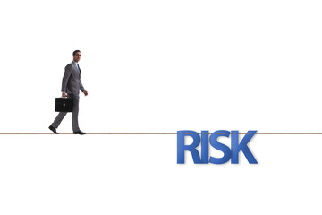 Businessman in risk concept walking on tight rope