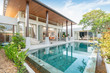 © Stock PK - home or house building Exterior and interior design showing tropical pool villa with green garden