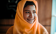 © chayathon2000 - Portrait of young Muslim woman wearing orange headdress