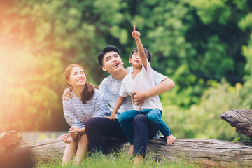 happy harmonious family outdoors concept.father mother and son have activities together on holidays.