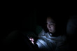 © reewungjunerr - Asian woman playing game on smartphone in the bed at night,Thailand people,Addict social media
