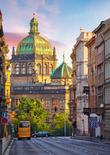 Street In Prague, Czech Republic. Cityscape With Road And View At Dome Of National Museum Building. Transport And Bus At Crossroad. Dawn Early Morning In Centre Of City.