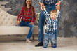 © Iryna - Happy family with child boy are playing in jeans