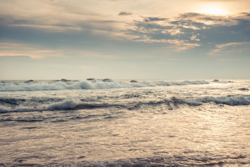 Sea beach surf waves landscape at sunset with dramatic sunset sky vintage style beige colors