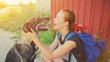 © raisondtre - Portrait young hipster woman with backpack kissing dog outdoors Happy pet and attractive girl playing fun Positive human friend emotions, facial expression, feelings Love between people and animal.