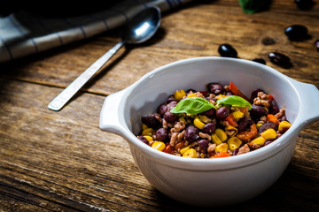 Wall Mural - Chili corn carne on wood table