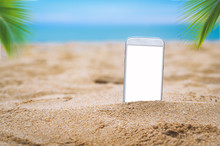 Smartphone In The Sand On A Beach In The Summer