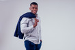 © yurakrasil - africa-american businessman holding coat over shoulder