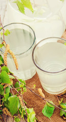 birch sap in a glass. Selective focus.