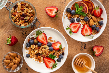 Sticker - Healthy breakfast concept. Homemade granola, honey, yogurt and fresh berries.