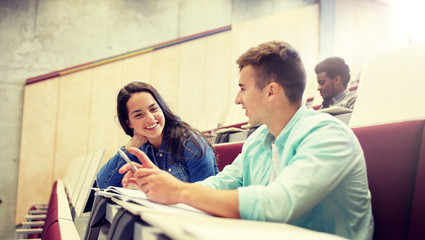 Sticker - education, high school, university, learning and people concept - group of international students with notebooks talking at lecture hall