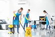 © Pixel-Shot - Team of janitors cleaning office