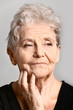 © Pixel-Shot - Portrait of senior woman on grey background
