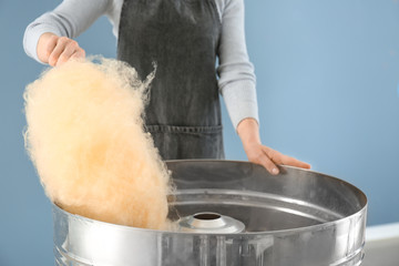 Woman making cotton candy at fair