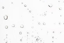 White Isolated Background Water Drops On The Glass / Wet Window Glass With Splashes And Drops Of Water And Lime, Texture Autumn Background