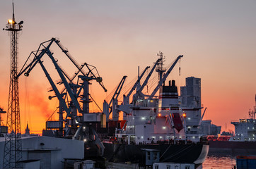  Freight international sea port with cargo ship. Port cranes. Global shipping, delivery and water logistics