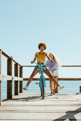 Wall Mural - Two girls enjoying on their vacation