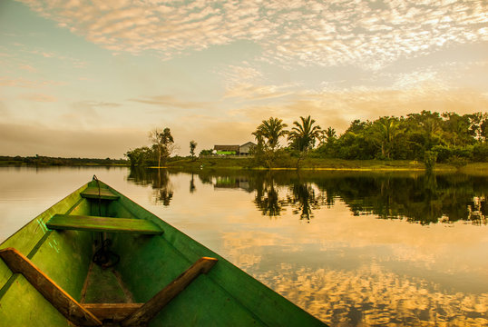 beautiful sunrise on the river. view from the boat at amazon river, with a dense forest on the shore