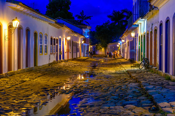 Fototapete - Night view of street of historical center in Paraty, Rio de Janeiro, Brazil. Paraty is a preserved Portuguese colonial and Brazilian Imperial municipality