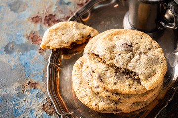 Wall Mural - Chocolate chip cookies on old rusty blue table. American cuisine. Copy space.