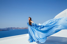 Young Beautiful Woman In Blue Dress
