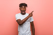 © Asier - Young african black man pointing to the side
