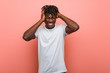 © Asier - Young african black man whining and crying disconsolately.