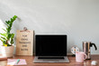 © Westend61 - Desk with laptop at home office