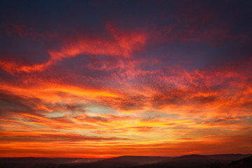 gorgeous orange sunset colorful clouds in evening sky, natural beauty of nature