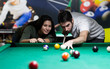 © Vesna - Young couple playing snooker