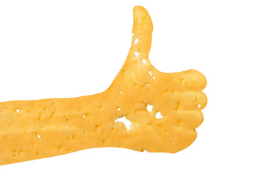 A hand cut out of cheese shows a “thumbs up” sign, a symbol of success, readiness, a task performed on a white isolated background.