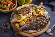Roasted Fish And Potatoes, Served On Wooden Tray - Image