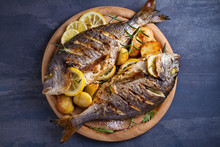 Roasted Fish And Potatoes, Served On Wooden Tray. Overhead, Horizontal - Image