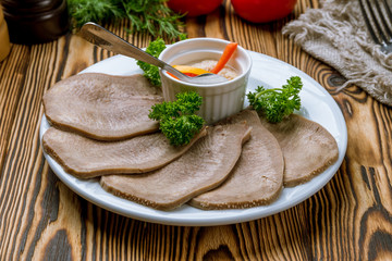 Sticker - Beef tongue with horseradish on white plate