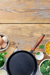 Wall Mural - Healthy breakfast top view with ingredient for cooking on wooden table with copy space