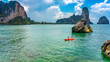 © Iuliia Sokolovska - Family kayaking, mother and daughter paddling in kayak on tropical sea canoe tour near islands, having fun, active vacation with children in Thailand, Krabi