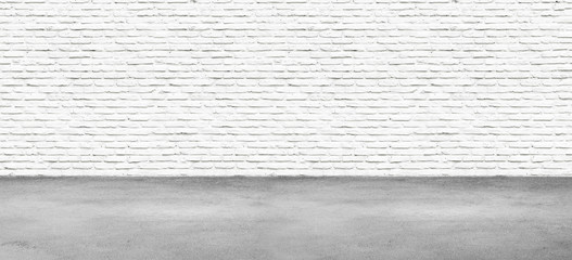 Room interior with white brick wall and concrete floor, nobody, empty.