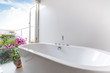 © Stock PK - Luxury bathroom features bathtub with flower
