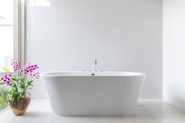 luxury bathroom features bathtub with flower